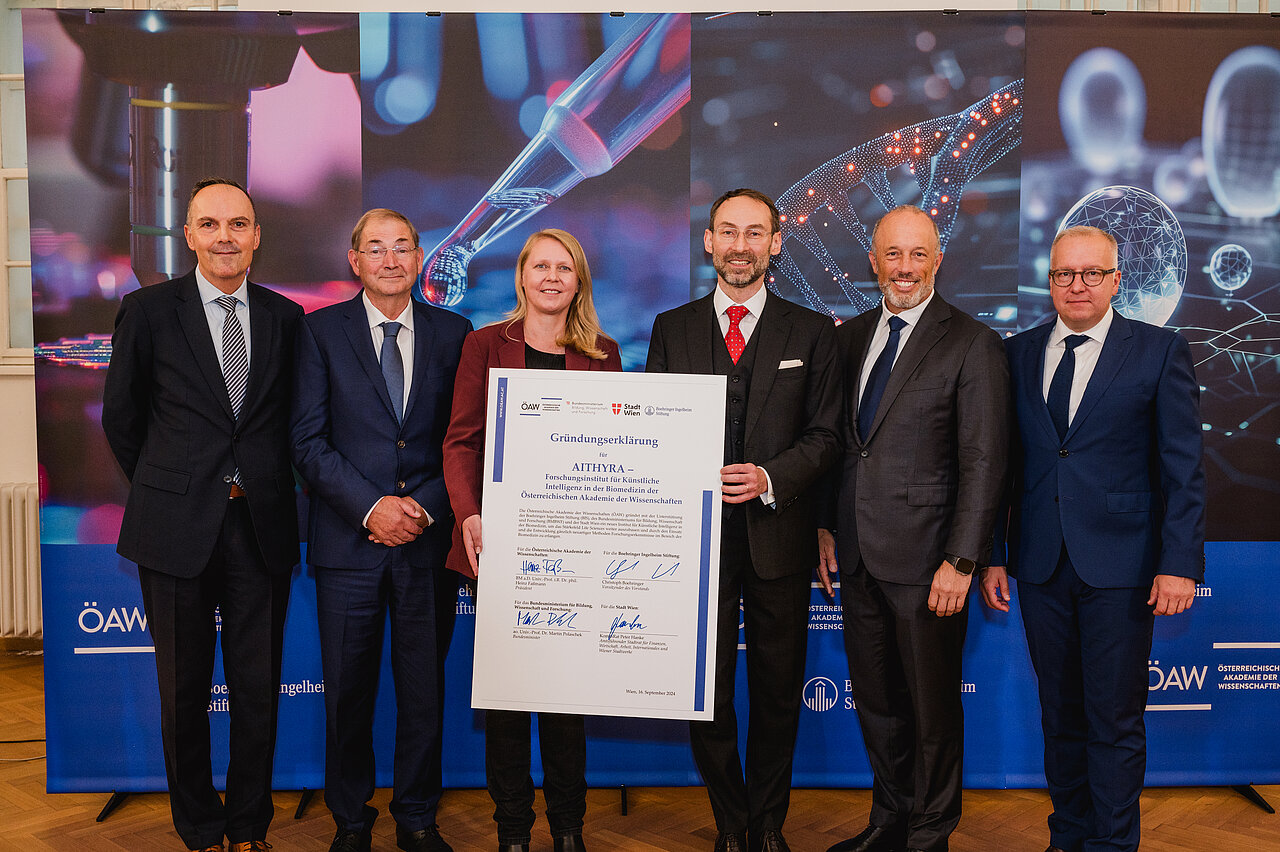 With the founding document from left: Marc Wittstock (Managing Director Boehringer Ingelheim Foundation), Michel Pairet (Boardmember Boehringer Ingelheim Foundation), Anita Ender (Managing Director AITHYRA), Michael Bronstein (Founding Director AITHYRA), Christoph Boehringer (Chairman of the Board of the Boehringer Ingelheim Foundation), Stephan Formella, (Managing Director Boehringer Ingelheim Foundation). Copyright: OeAW, N. Unkart