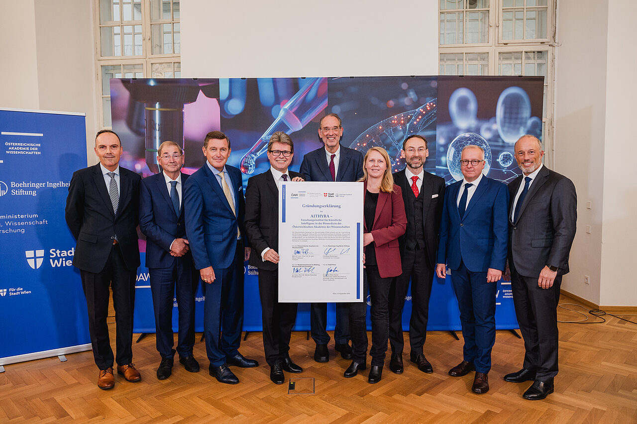 With the founding document from left: Marc Wittstock (Managing Director Boehringer Ingelheim Foundation), Michel Pairet (Boardmember Boehringer Ingelheim Foundation), Peter Hanke (Vienna City Councillor for Finance and Economy), Martin Polaschek (Austrian Federal Minister of Education, Science and Research), Heinz Faßmann (President of the Austrian Academy of Sciences), Anita Ender (Managing Director AITHYRA), Michael Bronstein (Founding Director AITHYRA), Stephan Formella, (Managing Director Boehringer Ingelheim Foundation), Christoph Boehringer (Chairman of the Board of the Boehringer Ingelheim Foundation), Copyright: OeAW, N. Unkart